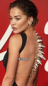 @Rita Ora redefined the red carpet at the British Fashion Awards 2023,  turning heads in a custom black gown by Primark and a breathtaking chrome  spine prosthetic. ✨ This bold fashion statement marked ...