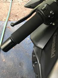 Takes about a minute and they go right over the stock grips and the heat still comes through nicely. Grip Puppies Ninja 400 Riders Forum