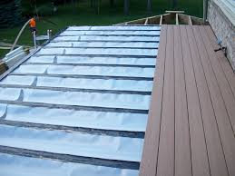 It also allows for installing certain electrical elements, such as lighting or a ceiling fan, while also protecting patio furniture. Under Deck Drainage Systems Howell Michigan Deck Builders
