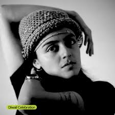 Happy Diwali to all who celebrate! In this captivating scene, men swirl  wands of gold-sparking fireworks, lighting up the dark ground with dazzling  patterns. In India, fireworks take center stage during Diwali,