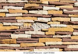 Brick walls add character to any room by serving as a focal point or providing a backdrop that either complements or contrasts the room's other design elements. Stone Wall Brick Texture And Background For Design Canstock