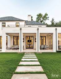 You'll also be the first to know when they release new music and merch. A Transitional Dallas Home With Georgian Style Architecture Luxe Interiors Design House Exterior Exterior Design Transitional House