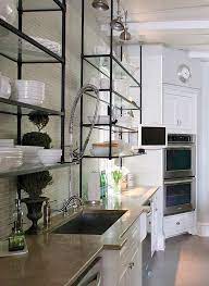These spice racks or pot racks are of metal made and with clean shelves to display all the kitchen bottles and utensils. Metal And Glass Shelves Open Kitchen Shelves Glass Shelves Kitchen Modern Kitchen