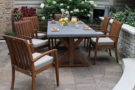 Eucalyptus Composite Dining Table And Eucalyptus Stacking Arm Chairs With Olefin Cushions Dining Table Outdoor Furniture Sets Outdoor Settings