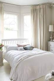 How to arrange furniture around a bay window: Serene Cream Bedroom Furniture Layout Bedroom Window Design Bedroom Layouts