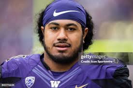 Washington Ezekiel Turner tackles Montana Shane Moody during a... News  Photo