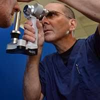 Lt. Cmdr. Carrie Glenn examines a patient at Martin Middle School in  Martin, Tenn.