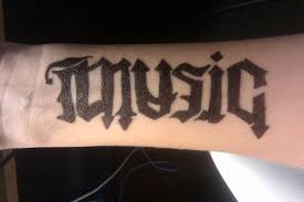It's also one of those symbols that is easily recognized. Black Ambigram Music Lettering Tattoo On Forearm By Liz