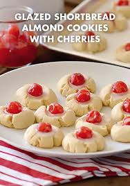 They are especially popular for christmas! These Glazed Shortbread Almond Cookies With Cherries On Top Are As Festive As They Are Delicious Great Fo Almond Cookies Holiday Cookie Recipes Cherry Cookies