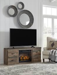 A fireplace is both a functional and decorative part of the home. Rent Signature Design By Ashley Trinell 60 Inch Electric Fireplace Tv Stand Same Day Delivery At Rent A Center