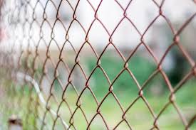 Chain link fence installation is ideal for diy for it is not complex. Wood Vs Chain Link Fence Pros Cons Comparisons And Costs