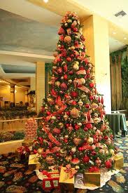 Christmas tree decorating can be really enjoyable and rewarding with a little thoughtful planning before diving into a giant box of ribbons and ornaments. Red And Gold Christmas Tree Gold Christmas Tree Decorations Red And Gold Christmas Tree Holiday Christmas Tree