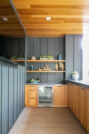 teak outdoor kitchen with dark gray