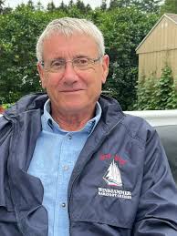 An Old Salt with his Sea Dog jacket. कৃश्व 1คร 初口 BAREFOOT КАРТАММЬ  BAREFDOTCRUSES CRUISES WINDJAMMER .