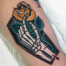 Tatuaje En El Brazo Ataud Con Mano Esqueletico Y Rosa Amarilla Tattooimages Biz