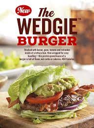 Stacked With Bacon Guac Tomato And Red Onion Inside Of A Lettuce Bun Then Wrapped For Easy Handling Thi Healthy Dining Healthy Eating Lettuce Wrapped Burger