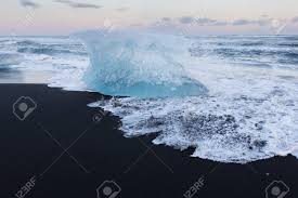 Find synthwave wallpapers hd for desktop computer. Ice Cube Breaking On Black Sand Beach Iceland Winter Season Lanscape Background Stock Photo Picture And Royalty Free Image Image 77214272