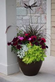 From old milk cans to fruit baskets to antique chairs, anything can be turned into a planter with a bit of creativity and gumption!these designs look great all year long; 65 Attractive Front Door Flowers Pot Ideas Patio Flowers Summer Planter Container Gardening Flowers