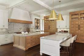Looking for fall themed kitchen goodies? Island Dining Table With Gold Pendants And Ivory Leather Stools Transitional Kitchen