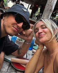 Ashley Roberts, 43, flaunts her jaw-dropping figure in a skimpy leopard  print bikini as she frolics