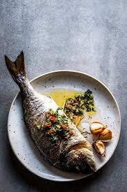 An Easy And Healthy Baked Fish Recipe This Whole Fish Is A Flavorful And Simple Weeknight Dinne Baked Whole Fish Whole Fish Recipes Healthy Baked Fish Recipes