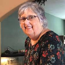 What is a good caption for a picture of a dachshund family in the rain?