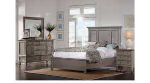 This is a whimsical and airy style with bright colors, a touch of floral patterns. Belmar Gray 7 Pc King Bedroom Panel Traditional