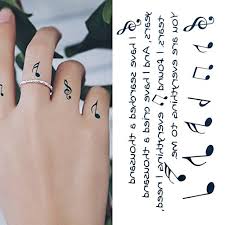 A swallow bird tattoo design with music note on the chest of women. Amazon Com Oottati Small Cute Temporary Tattoo Music Notes Finger Set Of 2 Beauty