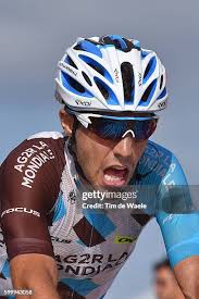 Iam's Swiss cyclist Mathias Frank crosses the finish line to win the...  News Photo