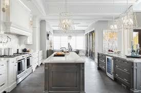Modern kitchen with two islands. Large Gray And White Kitchen Is Fitted With Two Islands Both Dark Gray Washed Kitchen Remodel Layout Farmhouse Kitchen Remodel Cheap Kitchen Remodel