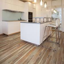 To clean vinyl flooring, mix 1 cup of vinegar with 1 gallon of hot water and mop the floor with this solution. Smartcore Ultra Richmond Oak Wide Thick Waterproof Interlocking Luxury 15 76 Sq Ft Lowes Com Vinyl Plank Flooring Vinyl Flooring Kitchen Luxury Vinyl Plank Flooring