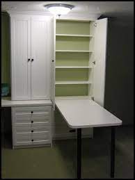 Hide Away Table There When You Need It Gone When You Don T And With More Storage Shelves Behind The Table Craft Room Storage Craft Room Office Sewing Rooms