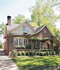 The home sits on a 1/2 acre parcel with a circular paver driveway and beautifully landscaped front and backyard. Tudor Style Home Ideas That Bring Old World Style Into The Modern Age Better Homes Gardens