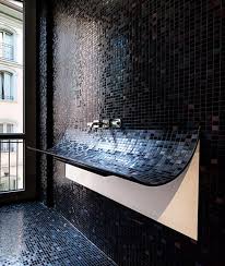 curved bathroom sink in mosaic tile