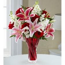 The Anniversary Bouquet Blossoms With Roses And Lilies To Display Your Love And Affection In Classic Gran Flower Delivery Anniversary Flowers Container Flowers