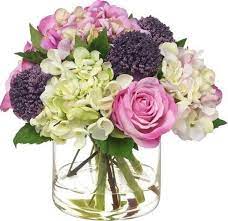 The best real flower arrangements actually use more than one type of greenery in them. 7 Faux Flowers That Look Impressively Real Fake Flower Arrangements Artificial Flower Arrangements Faux Flowers