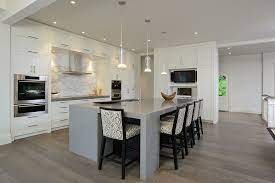 This beautiful contemporary gray and white kitchen offers a large open plan layout with an island big enough to seat three eat in diners. Grey Hardwood Graceful Grey Hardwood Floors Home Remodel Image Credit And Contact Grey Kitchen Floor Contemporary Kitchen Stylish Kitchen Design