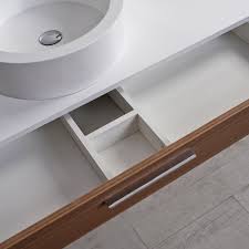 If you're designing a more compact bathroom, choose a slimline vanity unit to slot neatly beneath your small sink. Lusso Stone Edge Slim Drawer Wall Mounted Bathroom Vanity Unit Basin 1200 Vanity Units