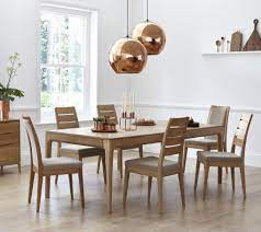 A Beautiful Contemporary Style In Pale Oak The Ercol Romana Modern Dining Collection Has The Warmt Oak Dining Chairs Oak Dining Table Extendable Dining Table