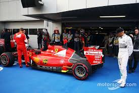 Lewis Hamilton Mercedes Amg F1 W06 Looks At The Ferrari Sf15 T Of Sebastian Vettel Ferrari In Parc Ferme At Russian Gp Mercedes Amg Lewis Hamilton Ferrari