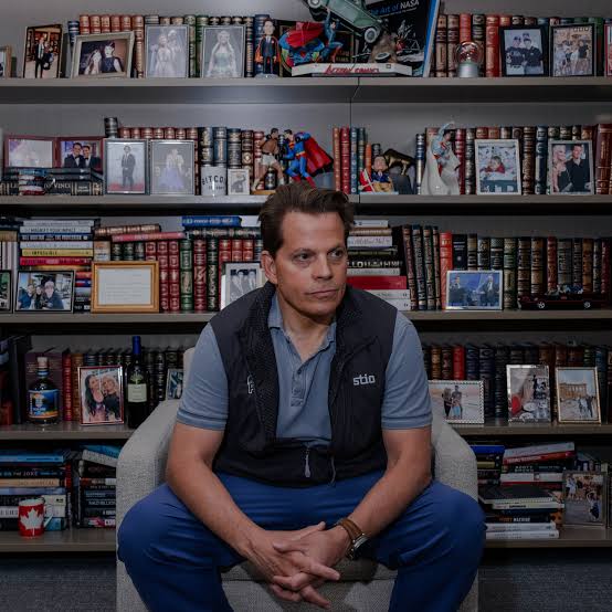 Anthony Scaramucci speaking into a professional microphone during a podcast recording session.