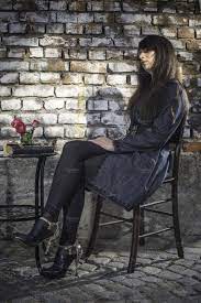 woman sitting on a chair in coffee s women sitting poses body poses