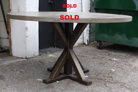 Made from plastic, this dining table is supported by a pedestal base with four flared legs and a cylindrical connector below the tabletop. Metal X Base Round Dining Table Mortise Tenon
