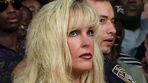 Ric Flair blows a kiss at Debra!