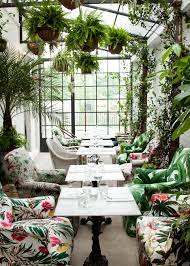 Step inside this modern take on a greenhouse. B H Buildings Light Filled Greenhouse Dining Room Via Coco Kelley Coco Kelley Coco Kelley