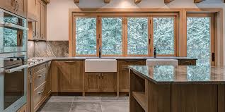 Fireplace, glass window walls with view, lighting (large pendant lights, accent chandelier). Why You Should Consider A Kitchen Pass Through Window Kolbe Windows Doors