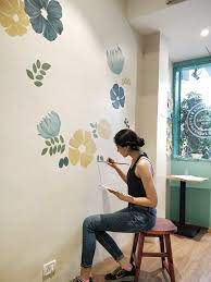 Then, pour primer in your paint tray and use a paint brush to line the outer edges of your walls with it. Painting A Wall Mural The Ink Bucket