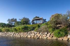 This house built on sloping area with a wonderful views to wilderness of nature below. This House Takes Advantage Of Its Elevated Views Of The Coastline Architecture