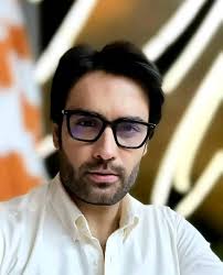 Not every face reveals the truth. Some looks are masks and some are  mirrors. This one? I am still figuring it out. Should he step in to the  light in my next?