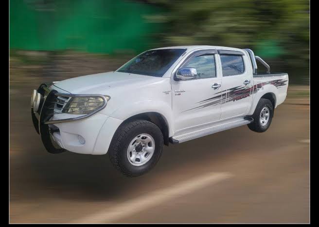 2006 Toyota Hilux Double Cab 4x4 in Pure White, AI generated